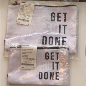 Two zippered Cosmetic or pencil bags.